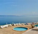 JELSA, CROATIA - August 23, 2018: Adriatiq Resort Fontana with pool and sea as a background in Jelsa